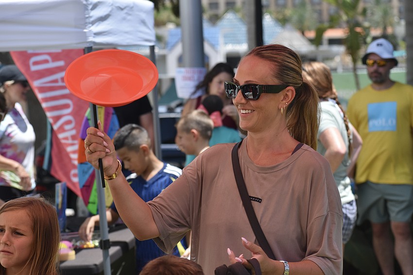 Leanne Varney twirls a plate with The Circus Arts Conservatory.
