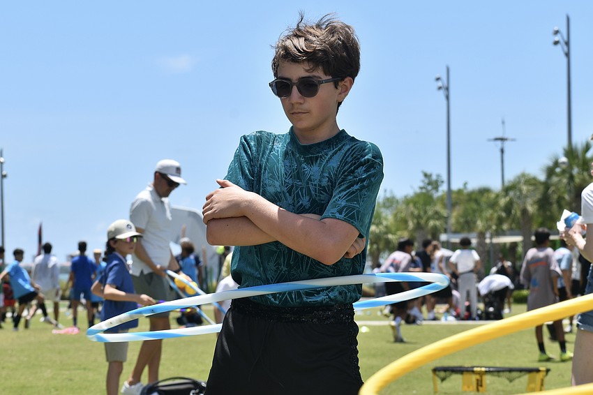 Ethan Winzeler, 12, does the hula hoop with The Circus Arts Conservatory.