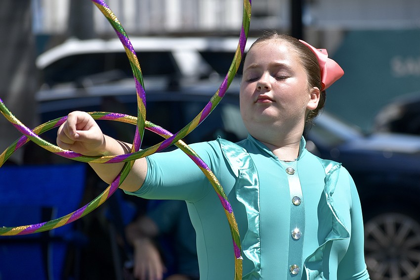 Cassidy Russell, 11, twirls hula hoops with The Circus Arts Conservatory.