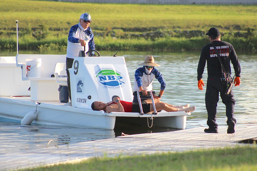 Community Rowing's Simeon John was so overcome with heat and exhaustion following his title run Sunday at Nathan Benderson Park that safety workers had to take him to the first aid station.