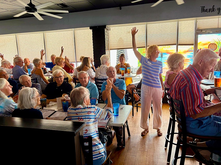 Christ Church of Longboat Key Rev. Julia Piermont asks who is new at the church's first summer lunch of the season held a Pork Belly's Eatery & Catering Co.