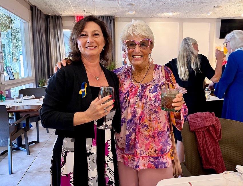 Guest Irina LaRose and member Connie DiMaggio attend the annual passing of the gavel for the Rotary Club of Longboat Key.