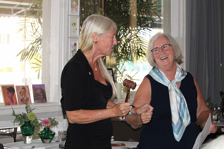 Rotary Club of Longboat Key President Terri Driver and District 6960 Governor Nominee Designate Sue McConnell share a smile during the passing of the gavel to the returning president.