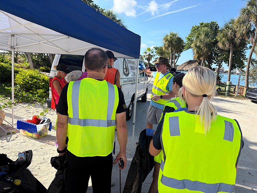 Cleanup coordinator Rob Loeffler directs the group of volunteers where to disperse for the Saturday morning sprucing.