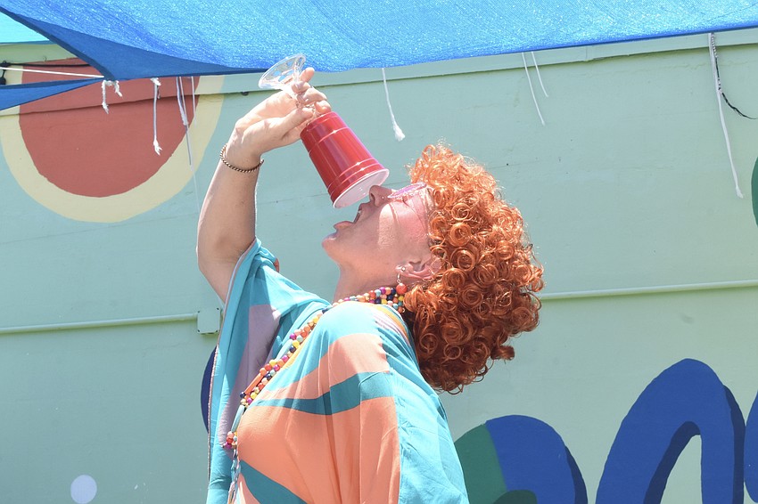 Janel Rowland takes a swig.