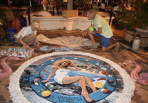Denise Kowal and Bill Baranowski work on the infiorata.