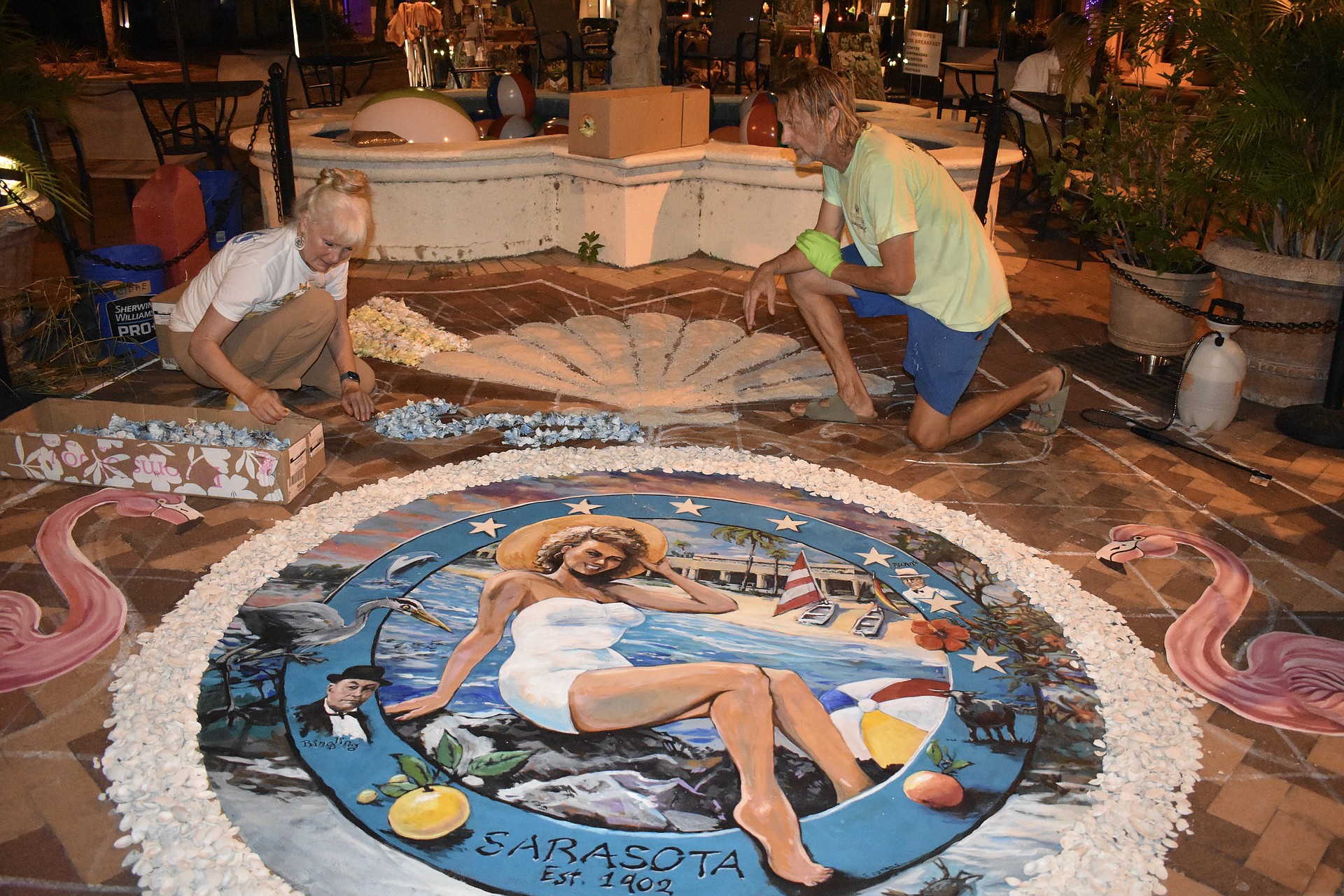 Denise Kowal and Bill Baranowski work on the infiorata.