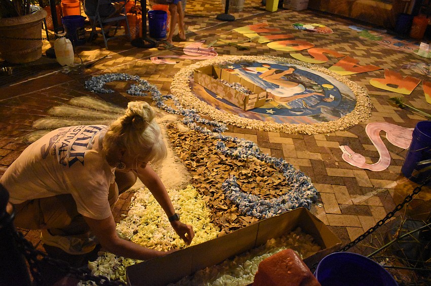 Denise Kowal works on the infiorata.