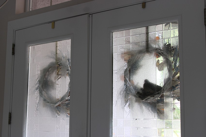 The Abdelsalams' front door windows are frosted, but they can watch the outline of the parents taking care of the babies.