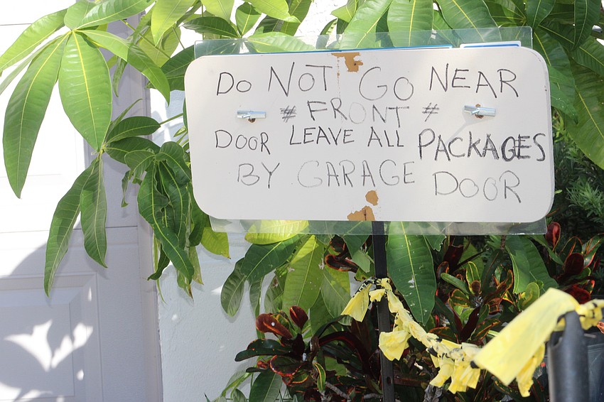 A sign warns those who approach not to use the walkway that leads to the Abdelsalams' front door.