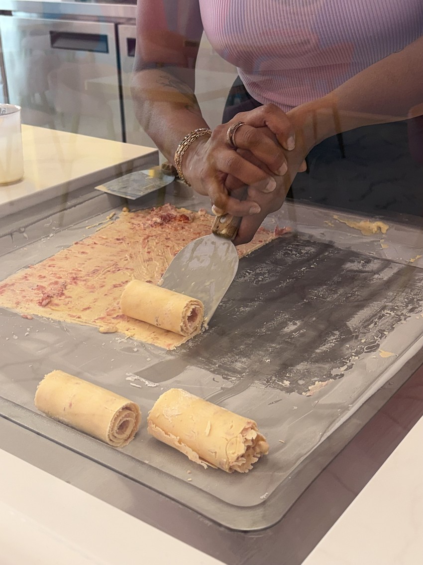 Rolly Polly Cow’s ice cream artists spend two to three weeks learning the menu and practicing how to properly create the signature ice cream rolls.