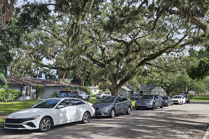Cars take over the street in front of a short-term rental house in Plantation Oaks. Cars take over the street in front of a short-term rental house in Plantation Oaks.