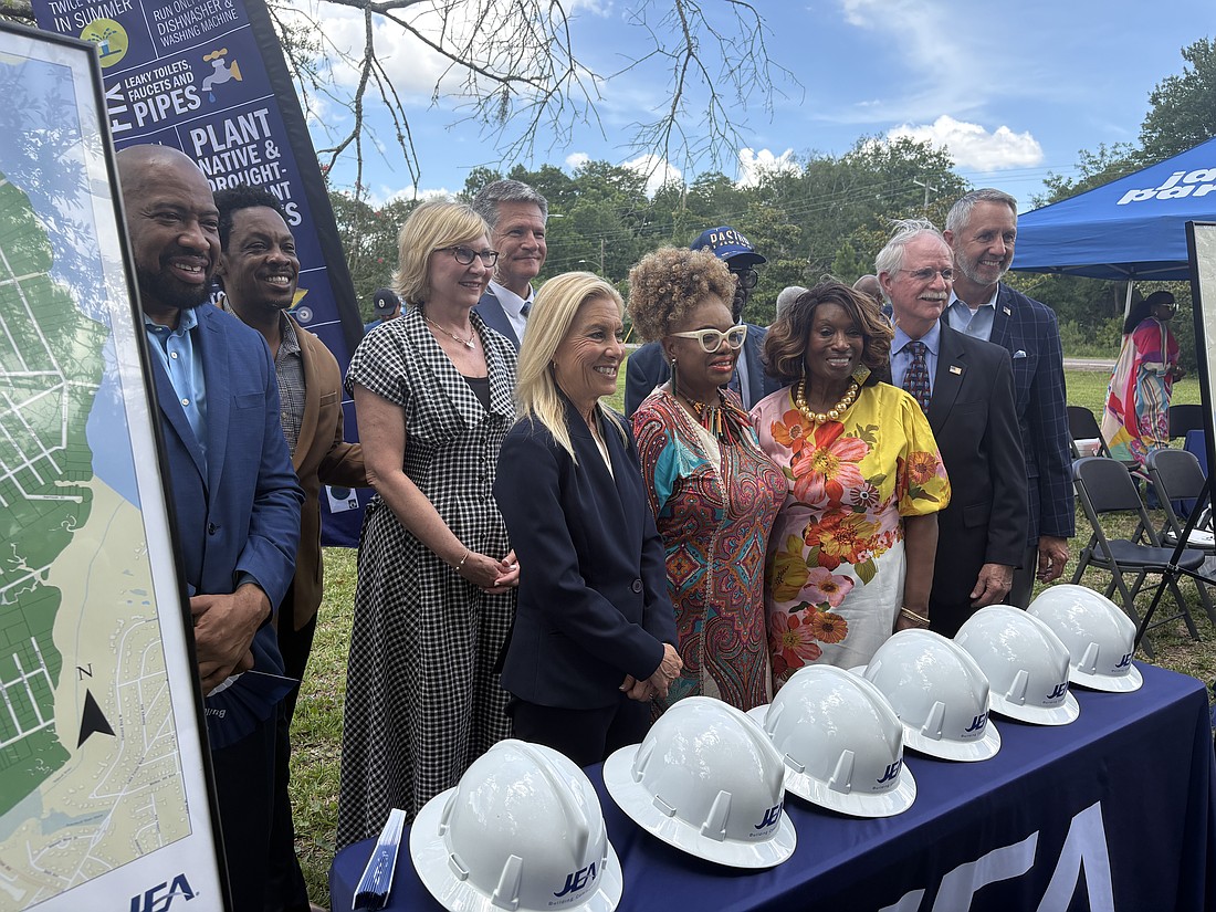 Mayor Donna Deegan, U.S. Rep. John Rutherford, EPA regional administrator Kevin McOmber, City Council members and others pose for pictures at the June 18 event.