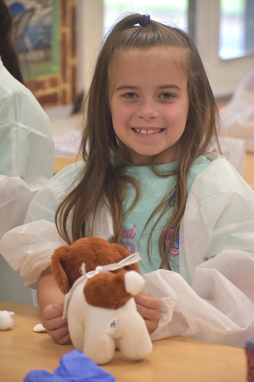 Adeline Eskew, a rising first grader at St. Martha Catholic School, is one of the campers to learn how to care for animals at the Little Vet School camp held at The Out-of-Door Academy.