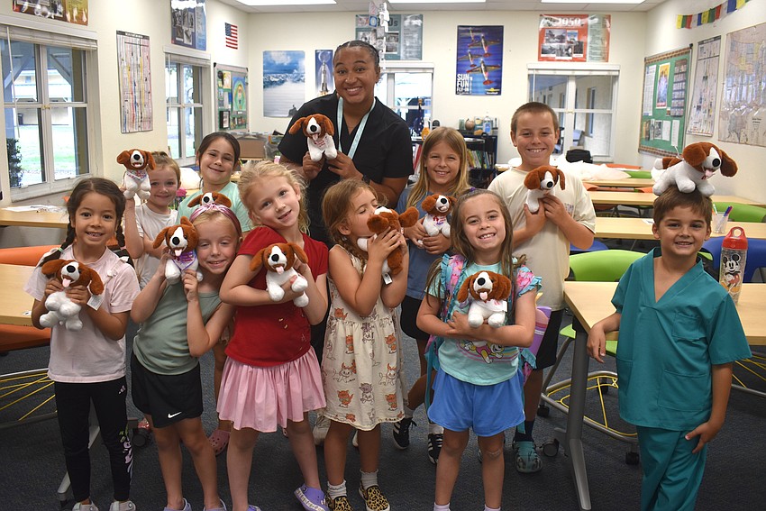 Little Medical School Suncoast's Little Vet School summer camp teaches campers many veterinarian skills, including how to remove a tick, how to remove an animal's earwax, and how to give a dog a pill.