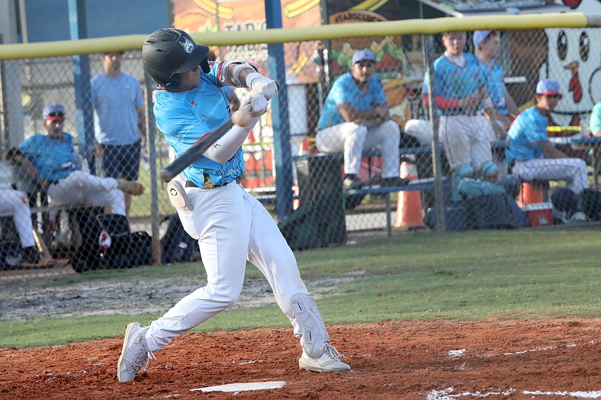 Big Buoys' Logan Shudy gets his bat on the ball. Photo by Brent Woronoff