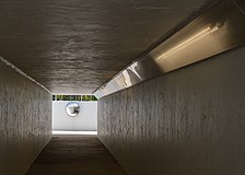 The pedestrian tunnel under State Road 789, locally known as Gulf of Mexico Drive, is illuminated by fluorescent lights.