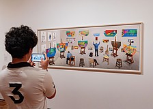A visitor to Sarasota Art Museum takes a photo of David Hockney's "Inside It Opens Up As Well," which collector Stanton Storer loaned to the museum for "Something Borrowed, Something New."