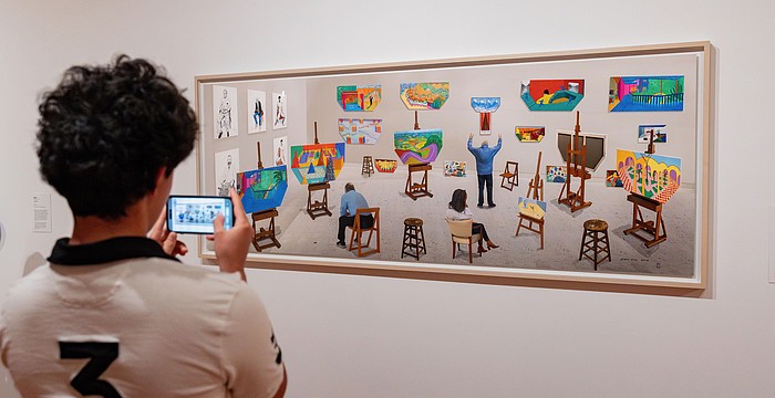 A visitor to Sarasota Art Museum takes a photo of David Hockney's "Inside It Opens Up As Well," which collector Stanton Storer loaned to the museum for "Something Borrowed, Something New."