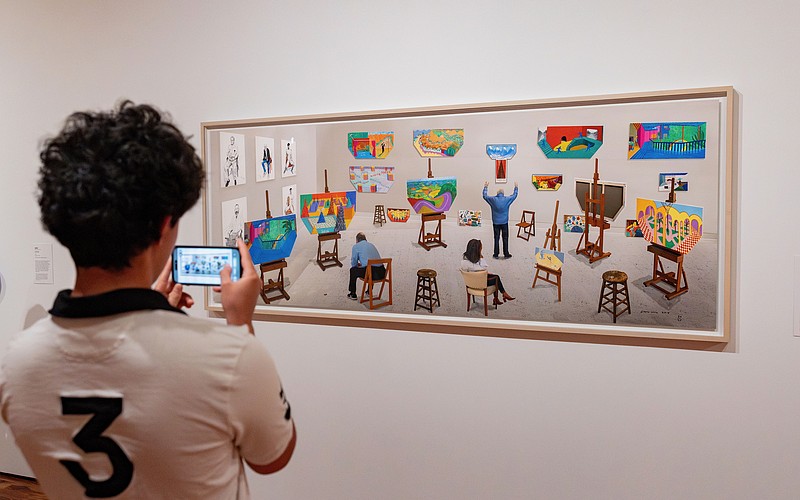 A visitor to Sarasota Art Museum takes a photo of David Hockney's "Inside It Opens Up As Well," which collector Stanton Storer loaned to the museum for "Something Borrowed, Something New."