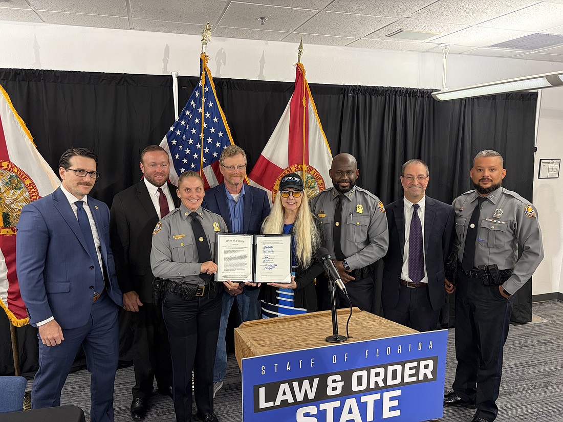 The bill was signed in Polk County alongside Officer Jason Raynor's family and members of the Daytona Beach Police Department. Courtesy photo