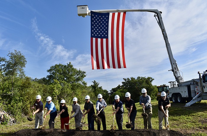 Manatee County staff and key stakeholders toss ceremonial dirt to kick off construction on a half-mile trail segment that will span from the Lake Manatee Water Treatment Plant to Rye Preserver.