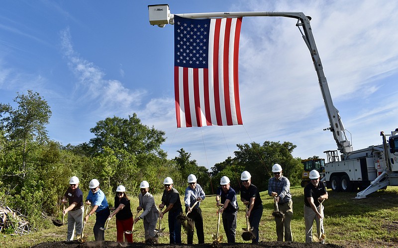 Manatee County staff and key stakeholders toss ceremonial dirt to kick off construction on a half-mile trail segment that will span from the Lake Manatee Water Treatment Plant to Rye Preserver.