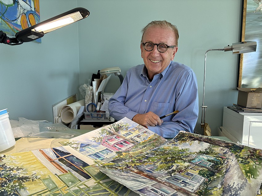 Jerome Chesley sits at his desk covered by his award-winning watercolors. Jerome Chesley sits at his desk covered by his award-winning watercolors.