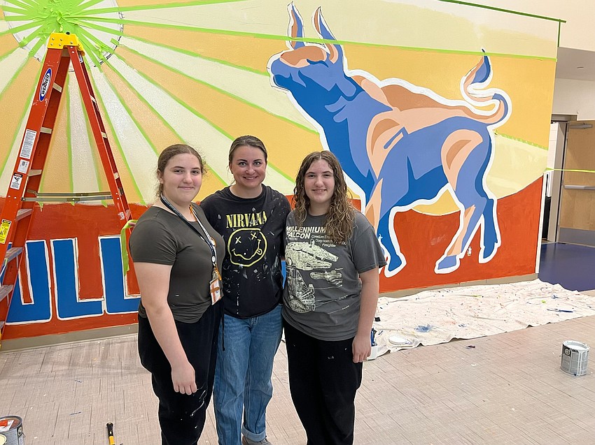 Amelia and Scarlett Evancic credit a lot of their passion and confidence in art to Katelyn Reyes, their Mona Jain art teacher, who assigned the mural. Amelia and Scarlett Evancic credit a lot of their passion and confidence in art to Katelyn Reyes, their Mona Jain art teacher, who assigned the mural.