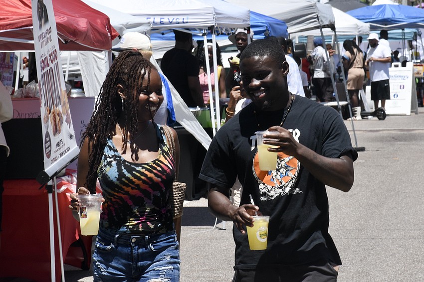 Stephani Bryant and Qua Davis take a walk through the festival.