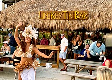 Kelera Turaga, a dancer with GRAE Productions, performs at sunset for The Ritz-Carlton's reopening celebrations for the Lido Key Tiki Bar on June 20. After a year-and-a-half rebuilding process, the beachside bar is now open to the public.