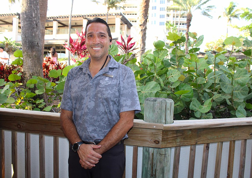 Juan Cordoba, director of beach club operations, welcomes guests to the Lido Key Tiki Bar grand reopening.
