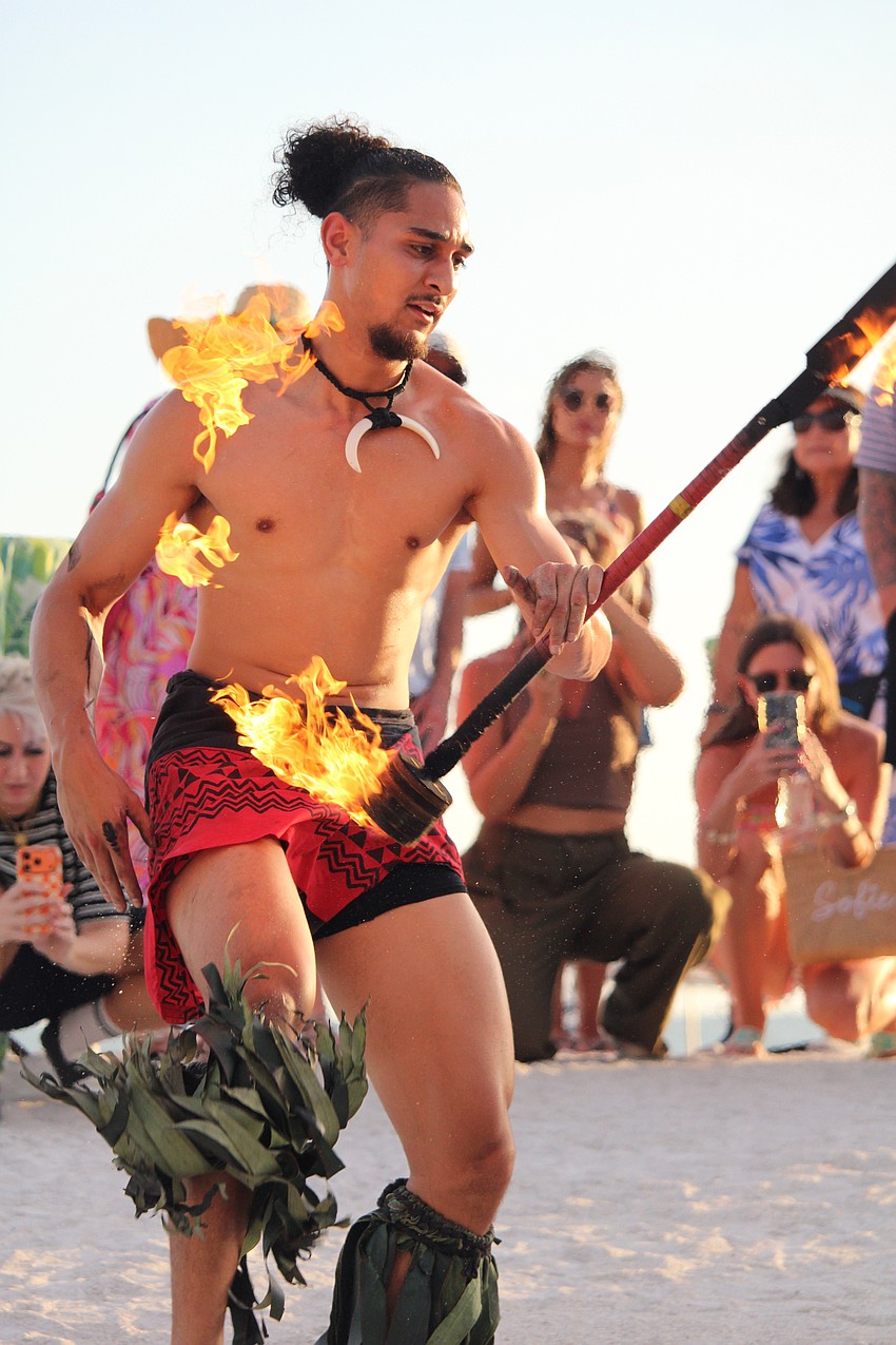 Flames were flying as part of the reopening festivities, with fire dancer Adam Netane performing.