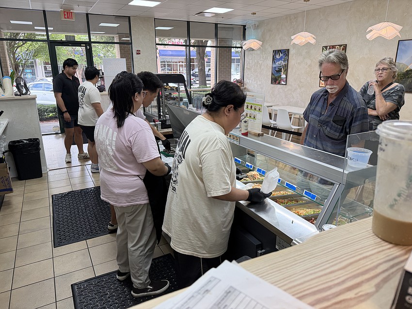 Lunch customers file in at Makai, which during its soft opening has been selling out and closing early.