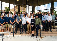 Director of Public Safety Jodie Fiske (in the front wearing black) stands with fire district staff from across Manatee County.