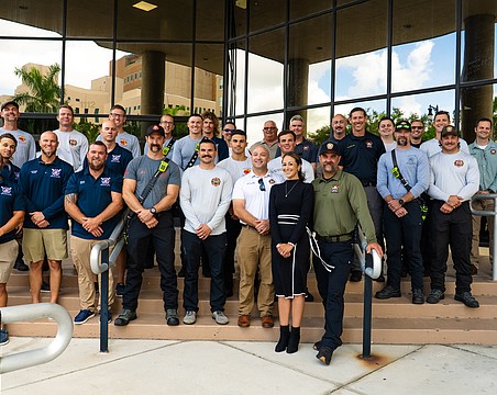 Director of Public Safety Jodie Fiske (in the front wearing black) stands with fire district staff from across Manatee County.
