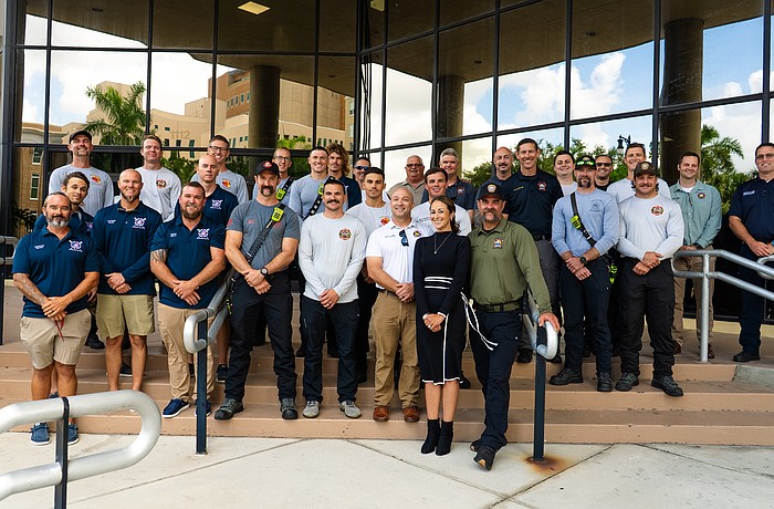 Director of Public Safety Jodie Fiske (in the front wearing black) stands with fire district staff from across Manatee County.