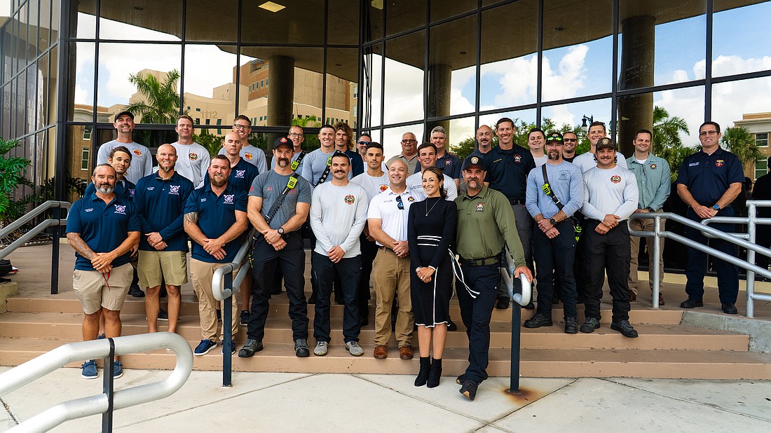Director of Public Safety Jodie Fiske (in the front wearing black) stands with fire district staff from across Manatee County.