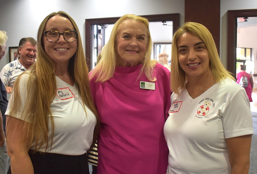 Service Dogs Saving Lives Board Member Ally Hatfield, Sisterhood for Good's Glo Reber and Service Dogs Saving Lives Secretary Yvette Ortiz celebrate the $3,500 grant that will assist in providing support to veterans and first responders.
