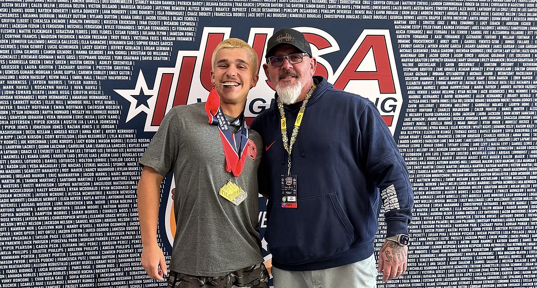 USA Weightlifting national champ Jackson Fedun with Flagler Palm Coast coach Duane Hagstrom. Courtesy photo