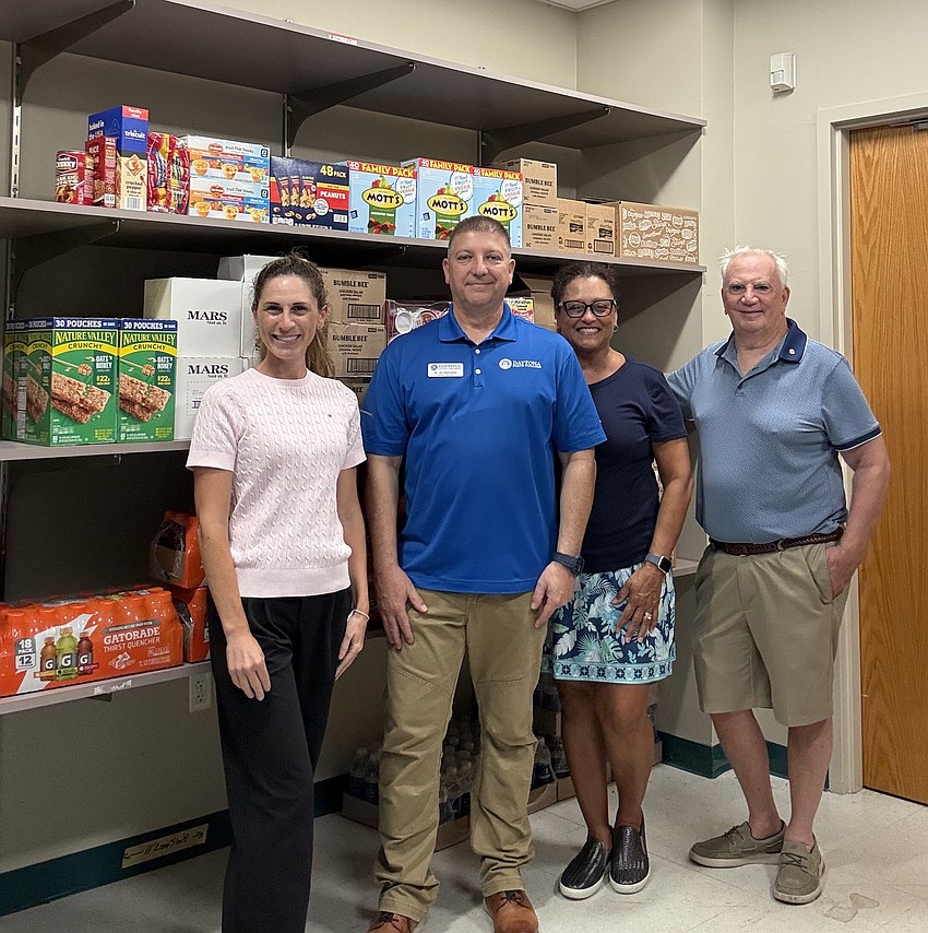 Members of the Rotary Club of Flagler County visit the Falcon Fuel Pantry on June 1. Courtesy photo