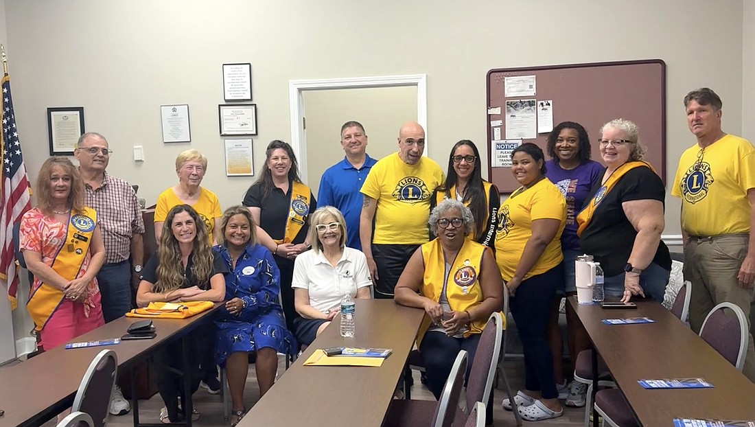 Members of the Palm Coast Lions Club and Rotary Club of Flagler County at the Lions Club meeting on June 8. Courtesy photo