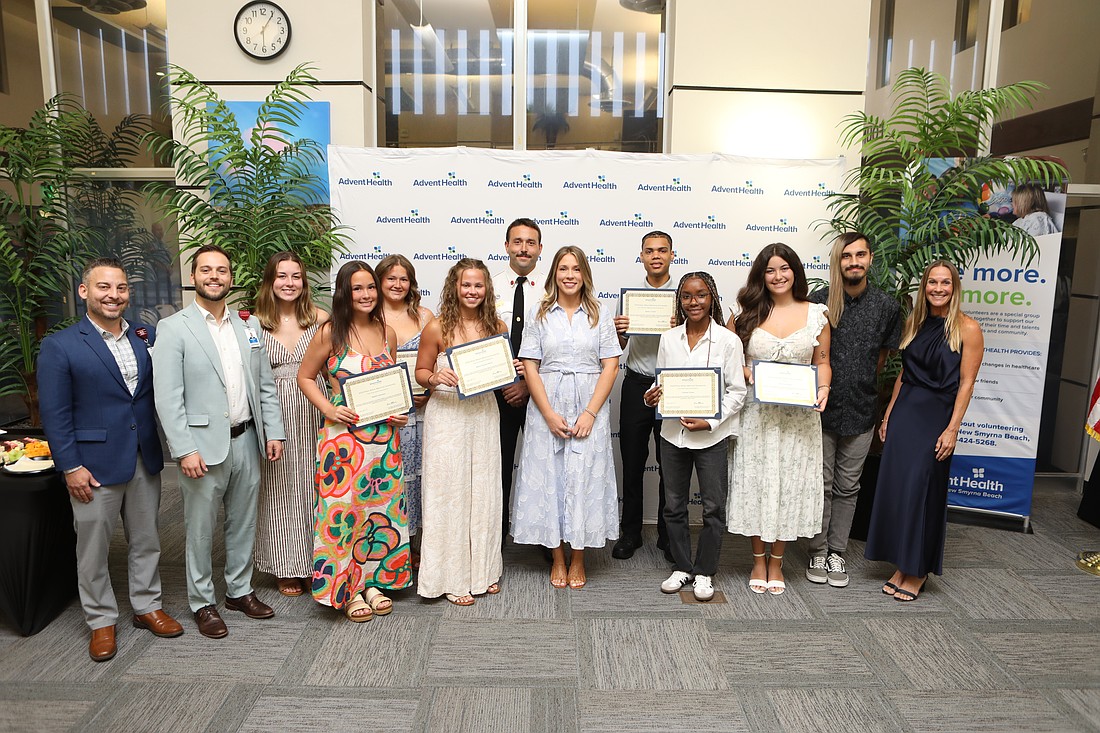 Recipients of the 2026 Ethan Wilson Memorial Scholarships gather with members of the Wilson family, AdventHealth New Smyrna Beach medical staff and Ormond Beach Fire Department representatives during the fourth annual scholarship awards ceremony. Courtesy photo