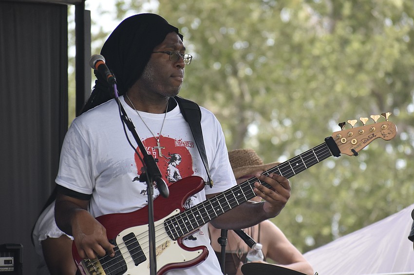 Bassist Johnnie Barker of The Barker Project performs on stage.