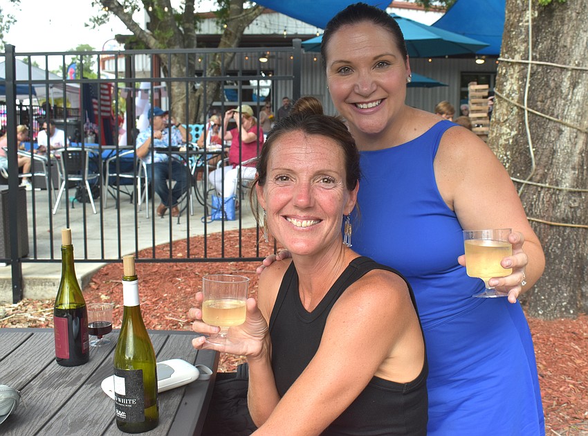 Lakewood Ranch's Lara Roberts and Aimee McKellick enjoy Arid White wine during the Red, White and Blueberry Celebration at Fiorelli Winery.