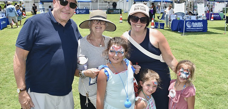 Gary St. Clair, his wife Elizabeth St. Clair, granddaughter Avianna Pereira, 7, daughter Allison Pereira, and granddaughters Adley Pereira, 5, and Amelia Pereira, 6, enjoy Sarasota Key Quest Fest.