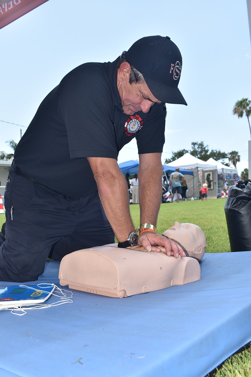 Travis Stafford of the Sarasota County Fire Department demonstrates CPR.