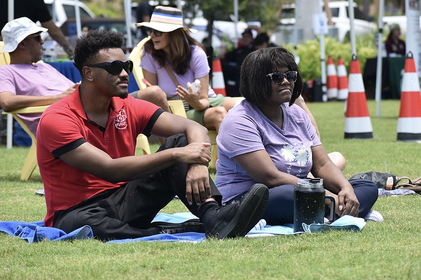 Jacob DeWitty and his mom Gresetta DeWitty watch his brother Jonathan DeWitty perform with The Barker Project.