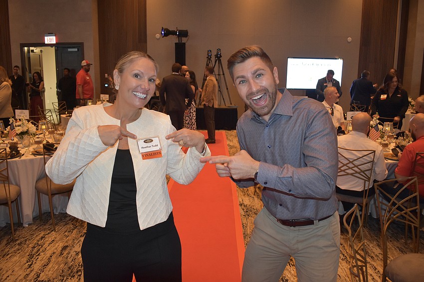 Heather Todd of Teen Court shares enthusiasm about the organization having become a finalist, with Mitch Lomazov, a keynote speaker and certified coach.