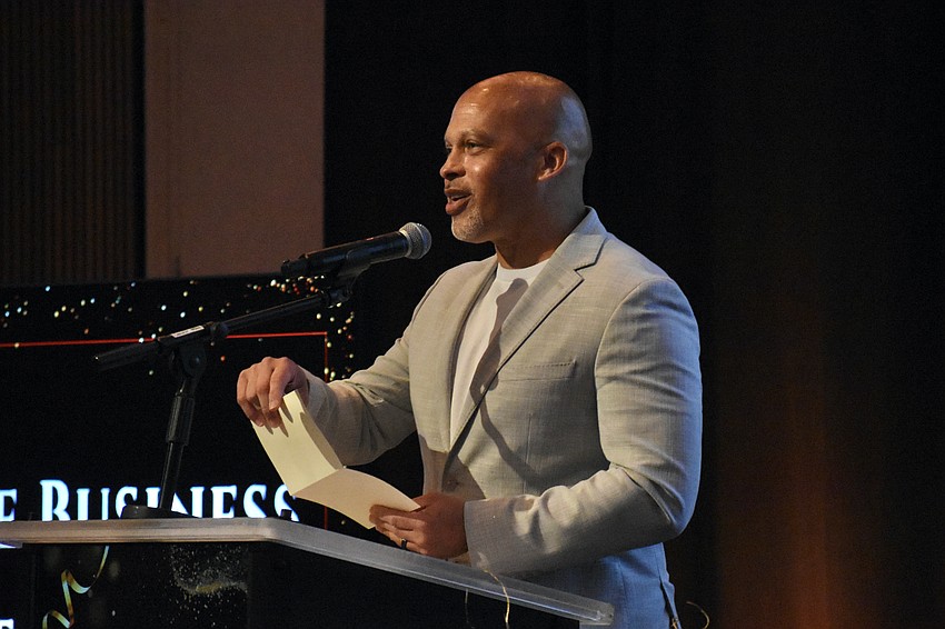 Aginto founder Chris Williams reads out the winner for the Large Business of the Year award.